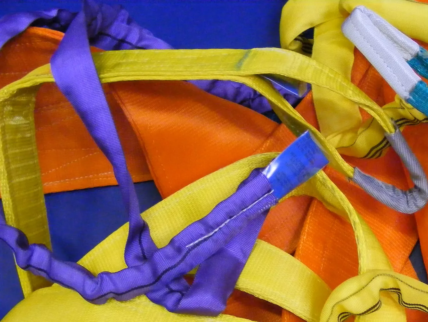 A colourful pile of polyester web slings as sold by Aberdeen Web Slings
