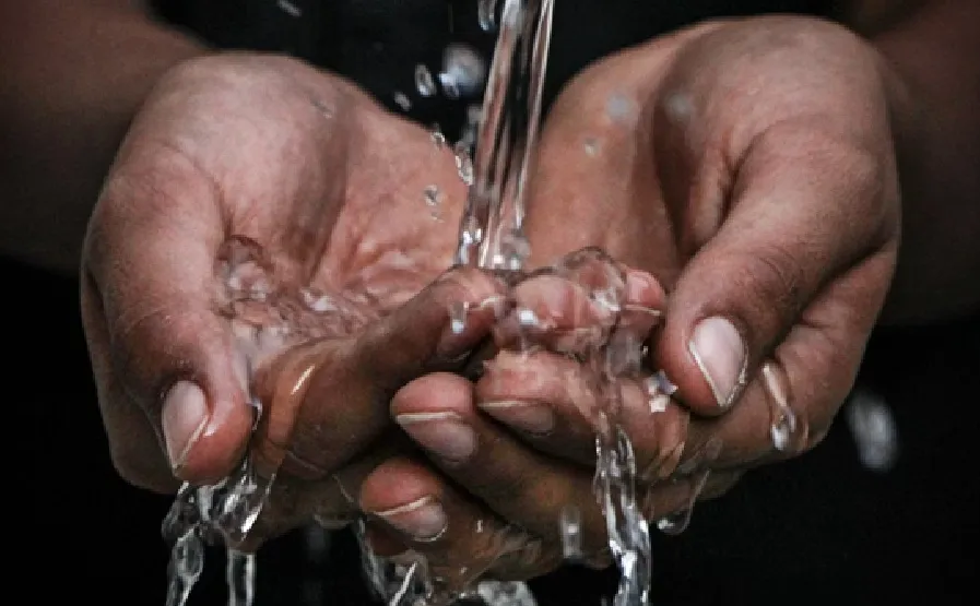 Water running through fingers